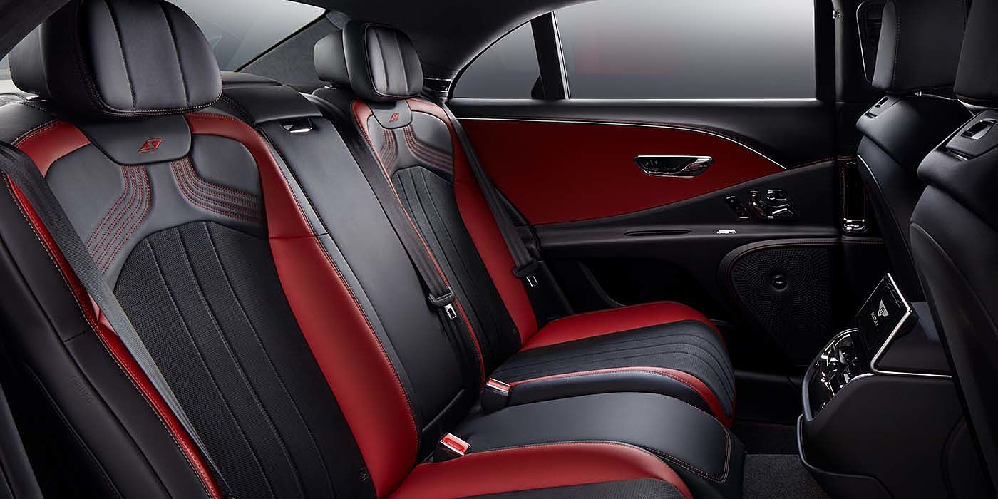 Bentley Katowice Bentley Flying Spur S sedan rear interior in Beluga black and Hotspur red hide with S stitching