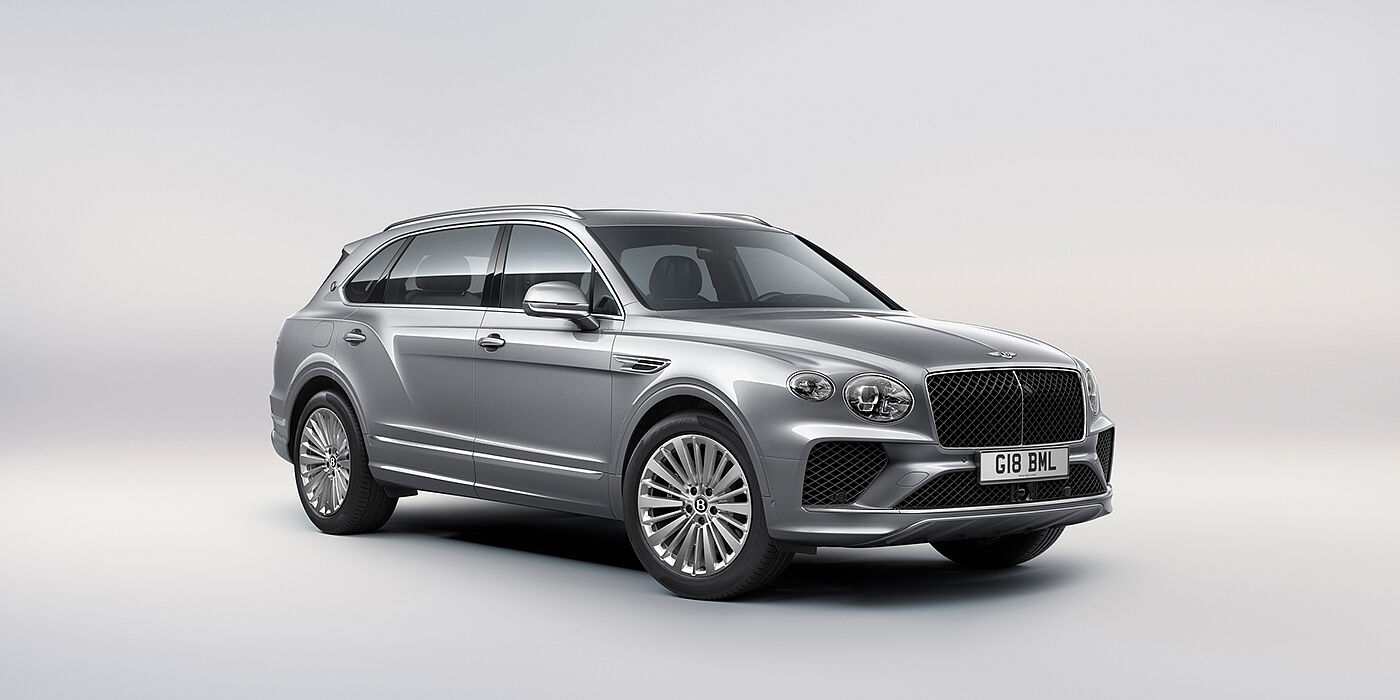 Bentley Katowice Bentley Bentayga Extended Wheelbase luxury SUV front three quarter view in Moonbeam paint with 21 inch five spoke painted wheels