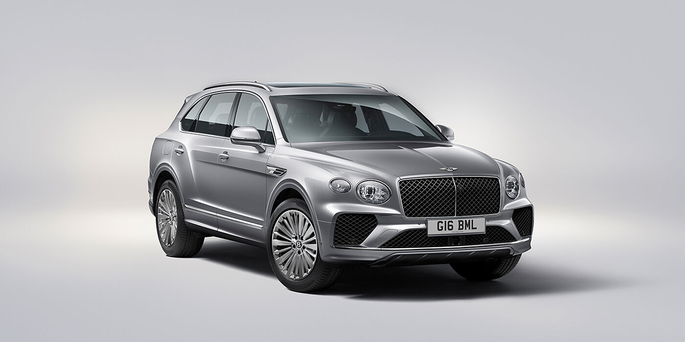 Bentley Katowice Bentley Bentayga luxury SUV front three quarter view in Moonbeam paint with matrix grille and 21″ 5 spoke painted wheels