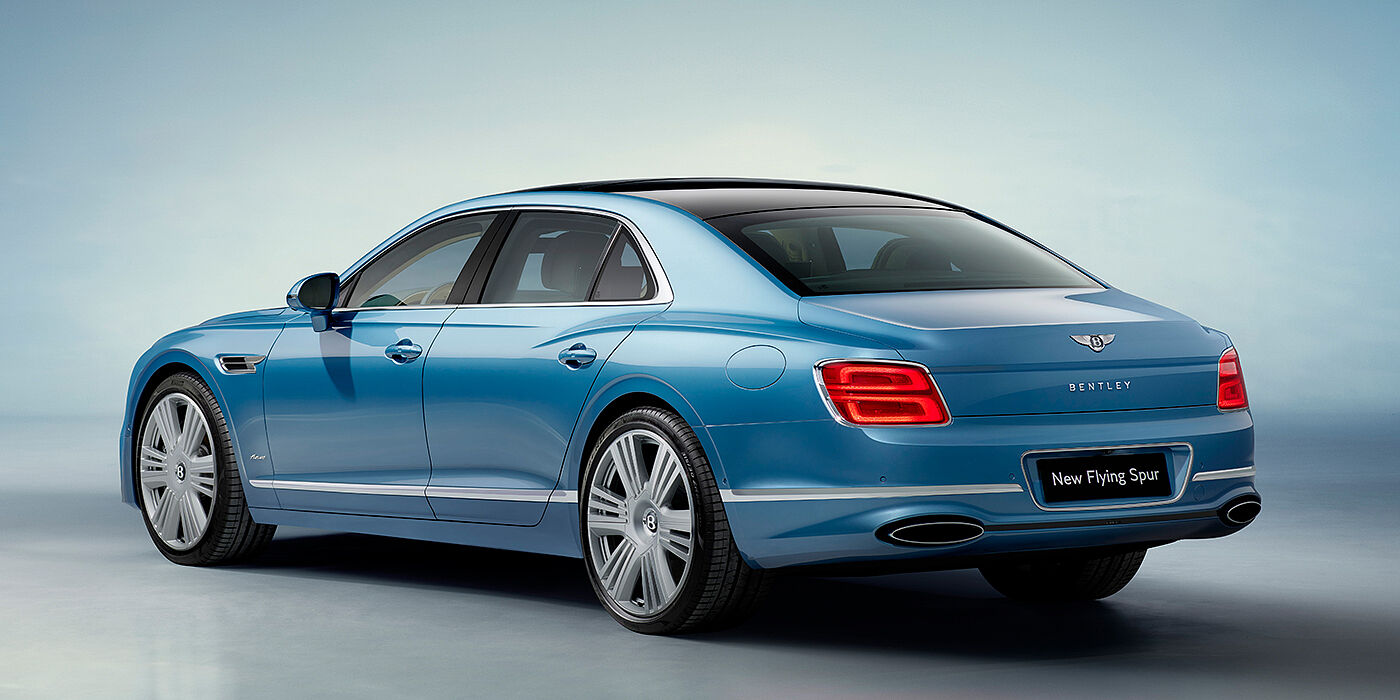 Bentley Katowice New Bentley Flying Spur Azure sedan rear view in Light windsor blue by Mulliner paint with 22 inch Azure wheels and chrome exterior details