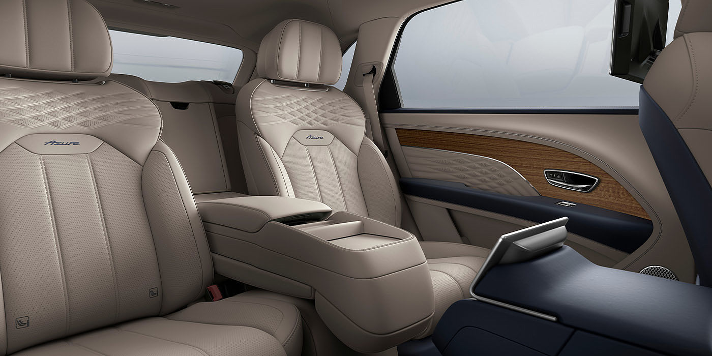 Bentley Katowice Bentley Bentayga EWB Azure interior view for rear passengers with Portland hide featuring Azure Emblem in Imperial Blue contrast stitch.