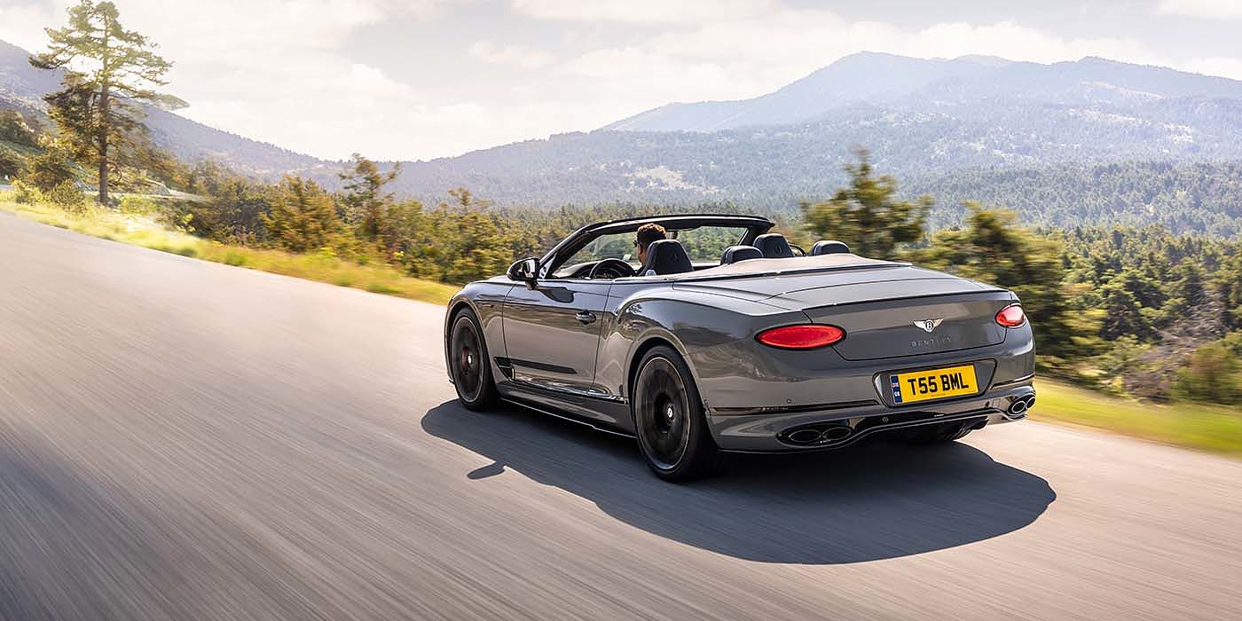 Bentley Katowice Bentley Continental GTC S convertible in Cambrian Grey paint rear 34 dynamic driving