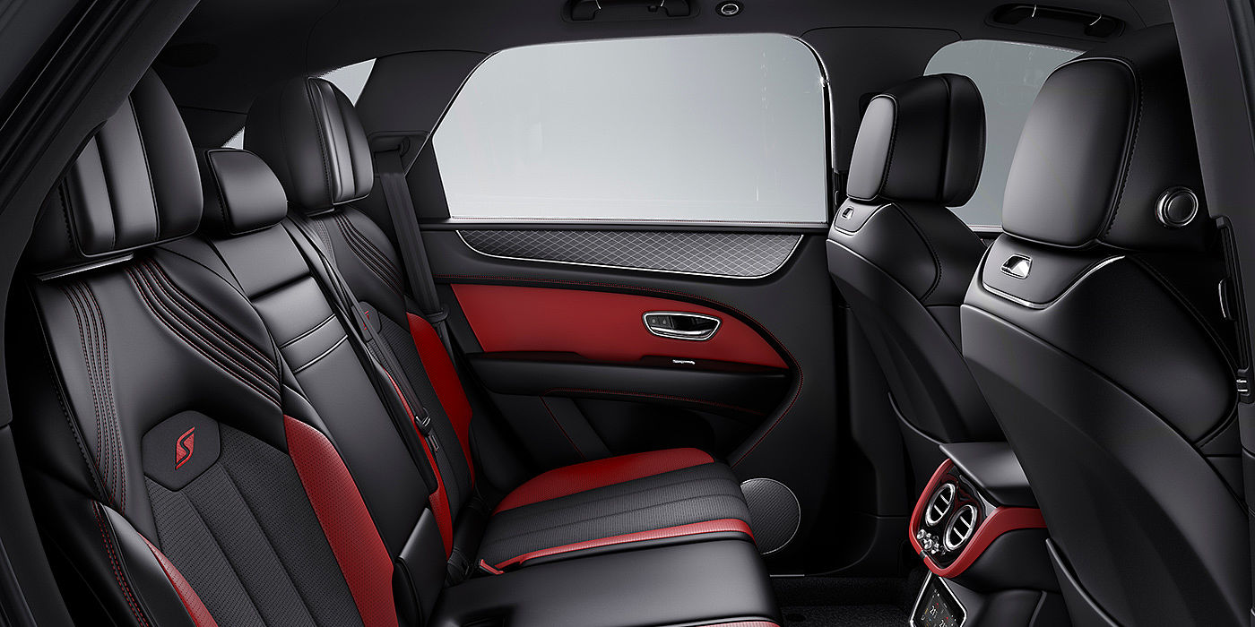 Bentley Katowice Bentey Bentayga S interior view for rear passengers with Beluga black and Hotspur red coloured hide.